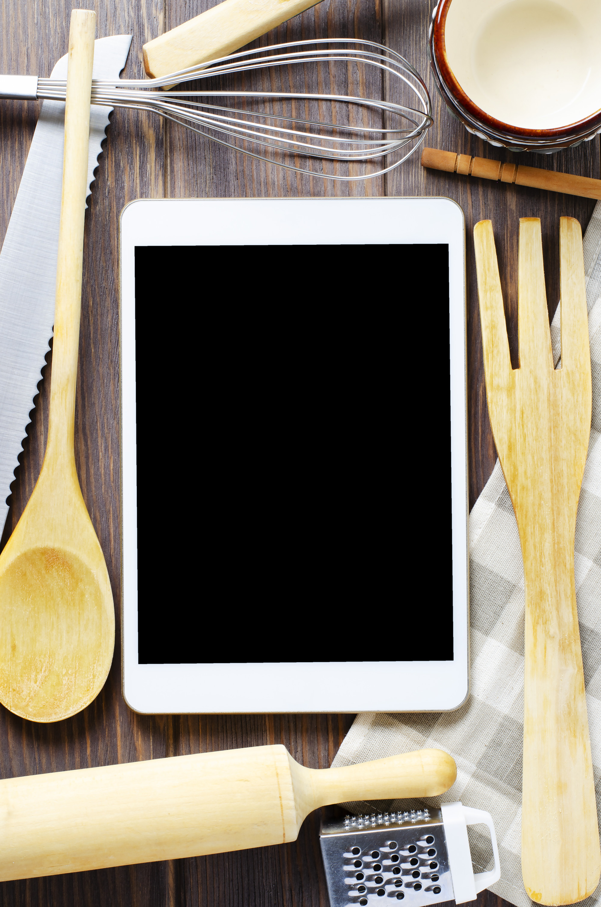 Set di utensili e schermo con lezione di cucina